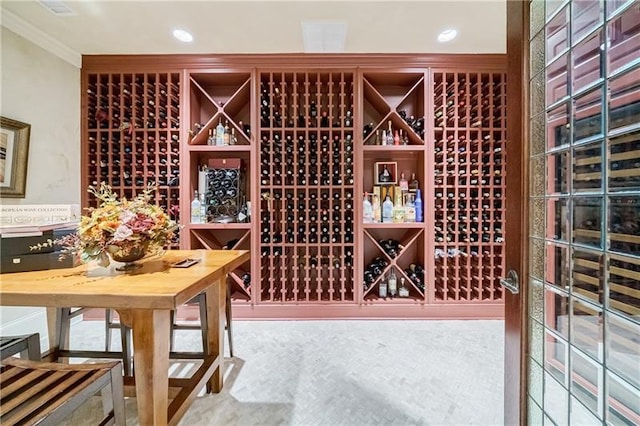 wine area with crown molding