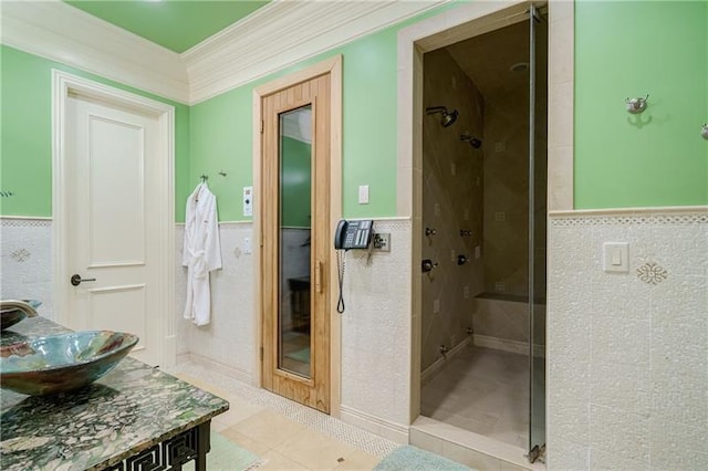 bathroom featuring tile walls and tiled shower