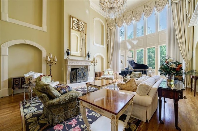 interior space featuring a notable chandelier, a high ceiling, and hardwood / wood-style flooring