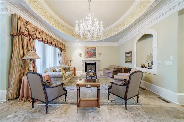 interior space with crown molding, a raised ceiling, and a notable chandelier