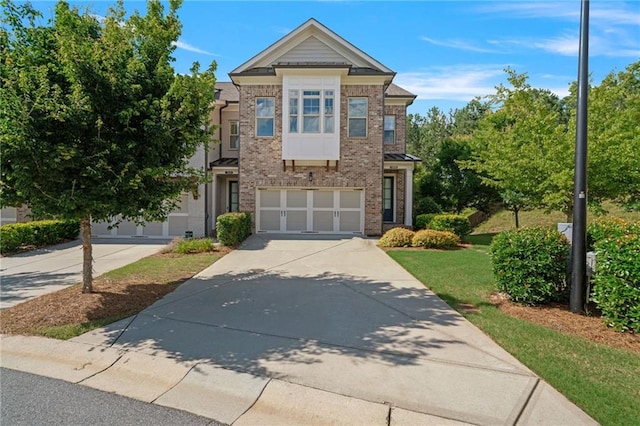 1858 Glenview Park Cir, Duluth, GA 30097 - view of front of property with concrete driveway, brick siding, a garage, and a front lawn