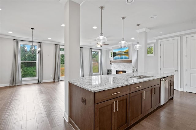 1858 Glenview Park Cir, Duluth, GA 30097 - kitchen with dishwasher, crown molding, a lit fireplace, open floor plan, and ceiling fan