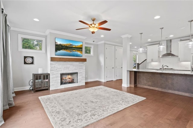 1858 Glenview Park Cir, Duluth, GA 30097 - living area with ceiling fan, healthy amount of natural light, crown molding, recessed lighting, and a fireplace