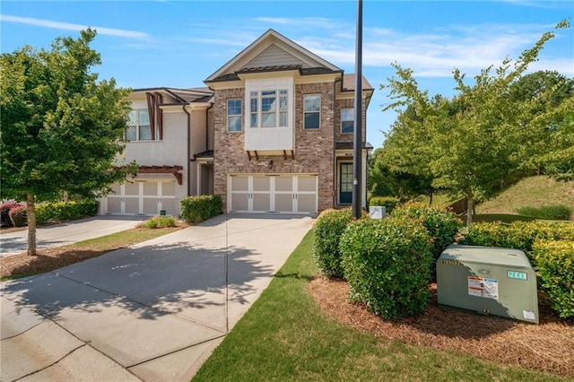1858 Glenview Park Cir, Duluth, GA 30097 - townhome / multi-family property featuring concrete driveway, a garage, and brick siding