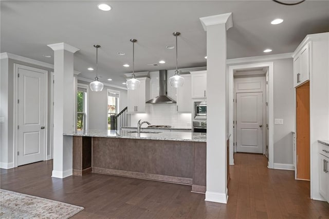 1858 Glenview Park Cir, Duluth, GA 30097 - kitchen with wall chimney exhaust hood, recessed lighting, crown molding, backsplash, and white cabinets