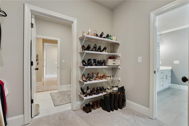 walk in closet featuring tile patterned flooring