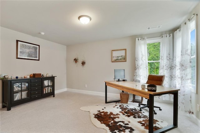 office with light colored carpet and baseboards