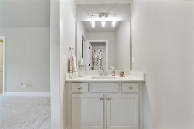 bathroom with vanity and baseboards