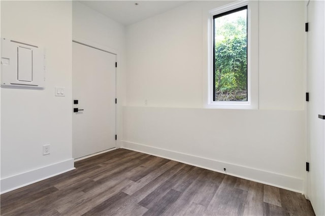 367 Parkway Dr NE Unit 9, Atlanta, GA 30312 - empty room featuring electric panel, dark wood finished floors, and baseboards