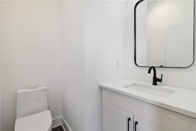 367 Parkway Dr NE Unit 9, Atlanta, GA 30312 - bathroom featuring vanity, toilet, and baseboards