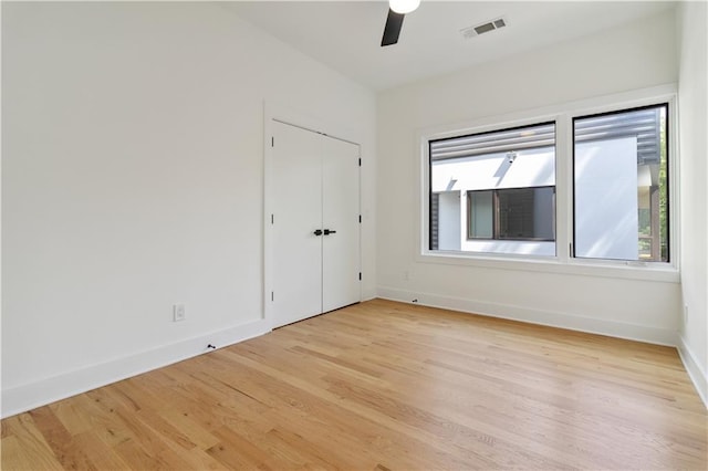 367 Parkway Dr NE Unit 9, Atlanta, GA 30312 - unfurnished bedroom with baseboards, light wood-style floors, ceiling fan, and a closet