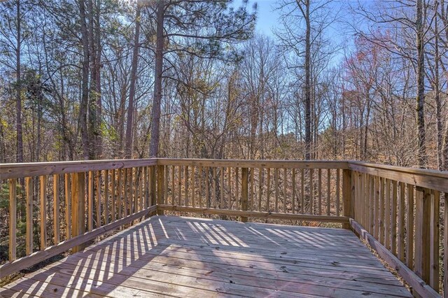 deck featuring a wooded view