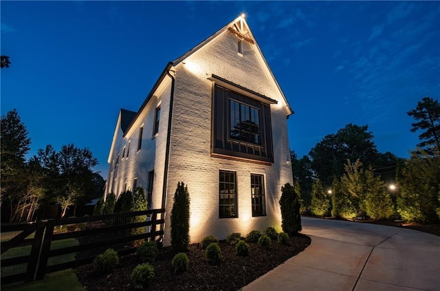 view of property exterior at twilight