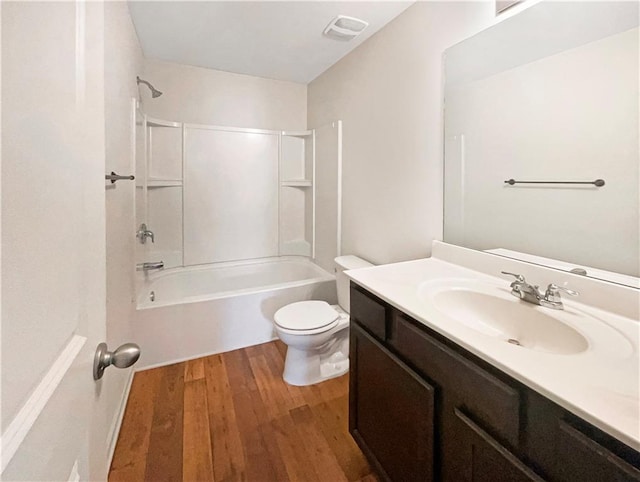 full bathroom featuring shower / bathtub combination, toilet, hardwood / wood-style flooring, and vanity