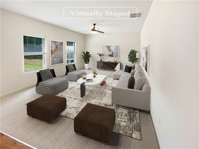 living room featuring light carpet and ceiling fan