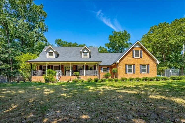 view of front of house with a porch and a front lawn