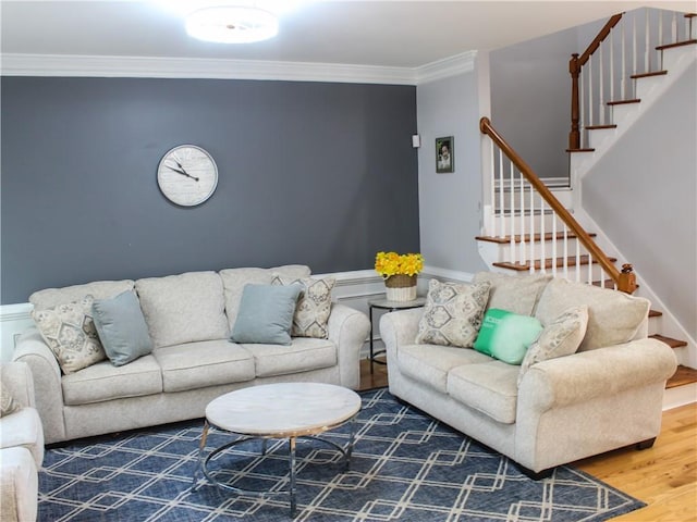 living room with crown molding and hardwood / wood-style floors