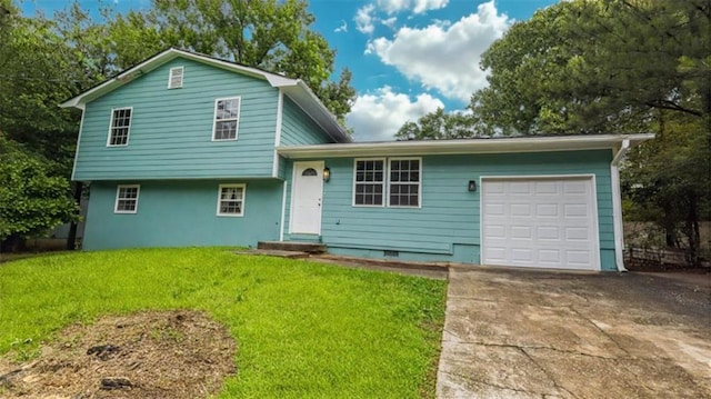 1328 Hoy Taylor Dr, Norcross, GA 30093 - tri-level home featuring an attached garage, a front yard, and driveway