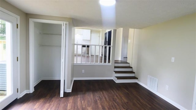 1328 Hoy Taylor Dr, Norcross, GA 30093 - unfurnished bedroom with wood finished floors, baseboards, and a closet