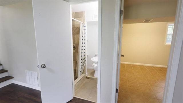 1328 Hoy Taylor Dr, Norcross, GA 30093 - bathroom with toilet, a stall shower, and baseboards
