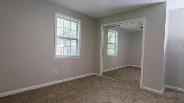 1328 Hoy Taylor Dr, Norcross, GA 30093 - unfurnished bedroom with carpet floors, multiple windows, and baseboards