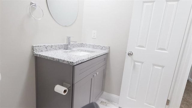 1328 Hoy Taylor Dr, Norcross, GA 30093 - bathroom with vanity, marble finish floors, and baseboards