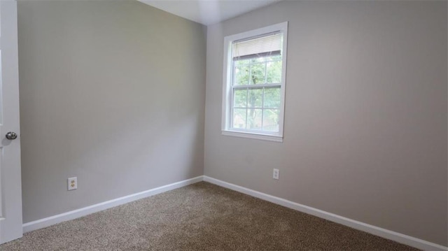 1328 Hoy Taylor Dr, Norcross, GA 30093 - carpeted empty room featuring baseboards