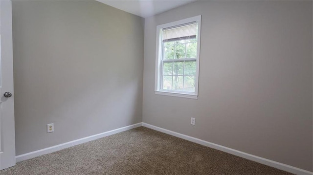 1328 Hoy Taylor Dr, Norcross, GA 30093 - carpeted empty room featuring baseboards