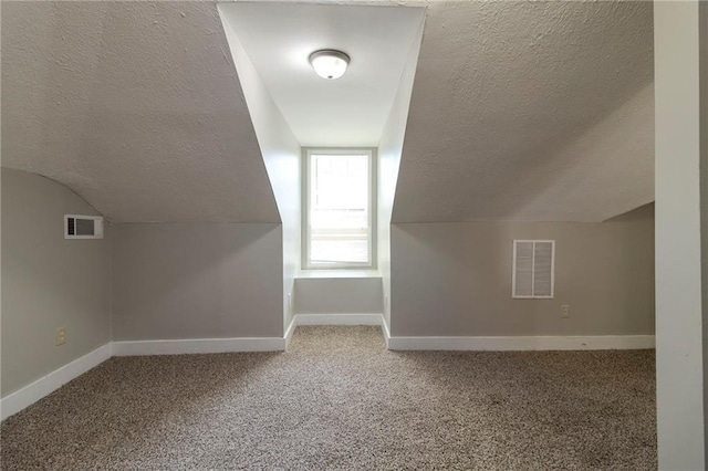1124 Lawton Pl SW, Atlanta, GA 30310 - bonus room featuring carpet floors, a textured ceiling, baseboards, and visible vents