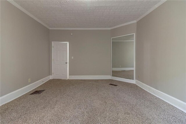 1124 Lawton Pl SW, Atlanta, GA 30310 - carpeted empty room featuring baseboards, a textured ceiling, ornamental molding, and visible vents