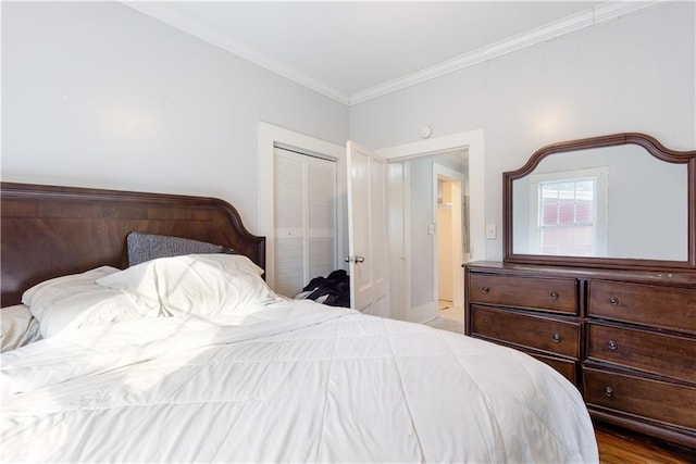 bedroom featuring a closet, crown molding, and light hardwood / wood-style flooring