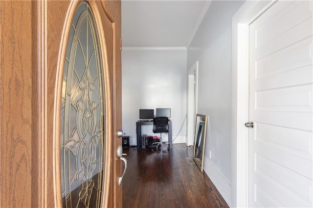 interior space featuring dark wood-type flooring and crown molding