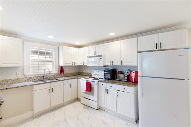 kitchen featuring white cabinetry, sink, white appliances, and dark stone countertops