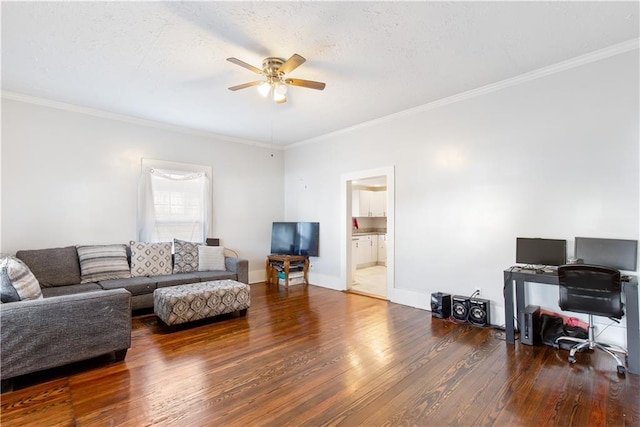 living room with ceiling fan, dark hardwood / wood-style flooring, ornamental molding, and a textured ceiling