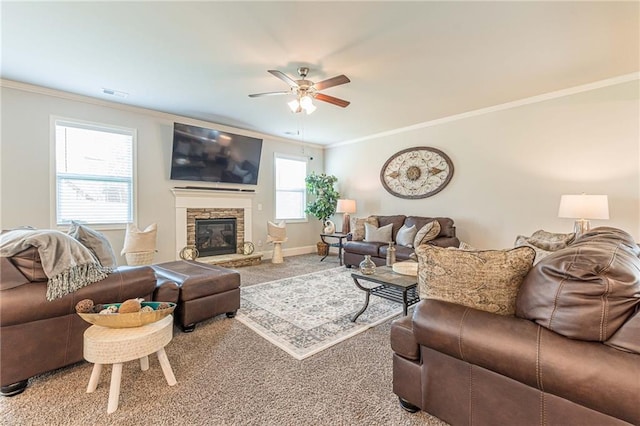 living room featuring plenty of natural light, ceiling fan, light colored carpet, and a fireplace