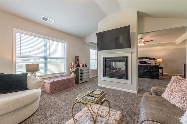 living room with lofted ceiling, carpet flooring, and ceiling fan