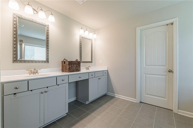 bathroom featuring tile flooring and dual vanity