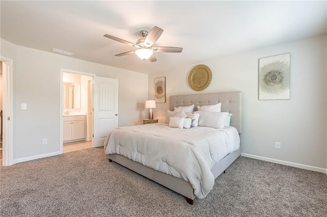 tiled bedroom featuring ensuite bath and ceiling fan