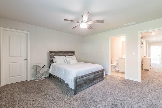 carpeted bedroom featuring connected bathroom and ceiling fan