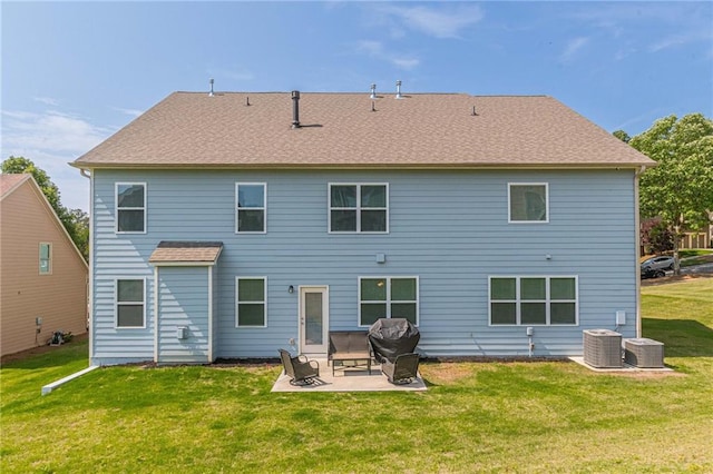 rear view of house with a patio area, a lawn, and central AC unit