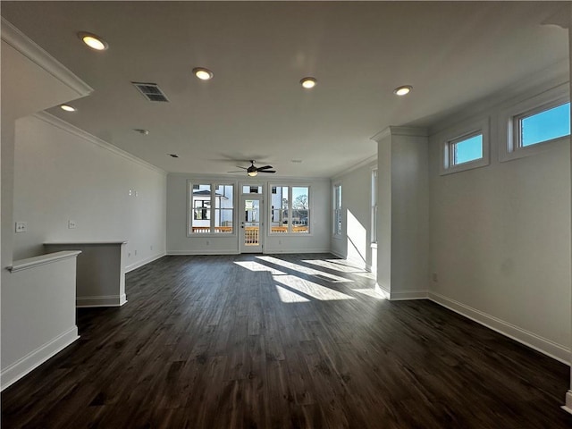 508 Healy Dr Unit 70, Cumming, GA 30040 - unfurnished living room featuring plenty of natural light, crown molding, baseboards, ceiling fan, and dark wood-style floors