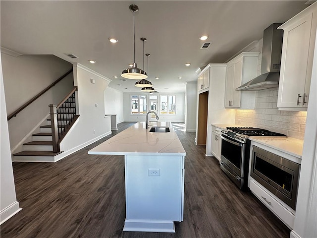 508 Healy Dr Unit 70, Cumming, GA 30040 - kitchen featuring wall chimney exhaust hood, stainless steel appliances, a sink, baseboards, and recessed lighting
