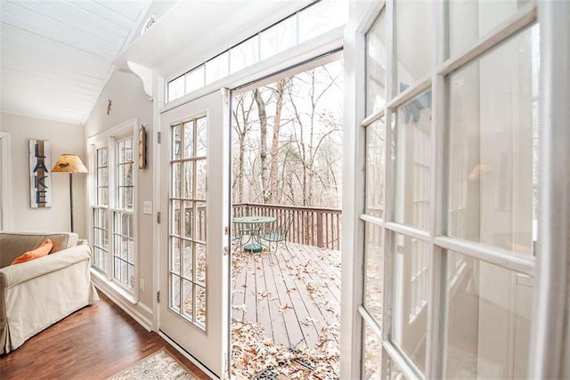 sunroom / solarium featuring lofted ceiling and french doors