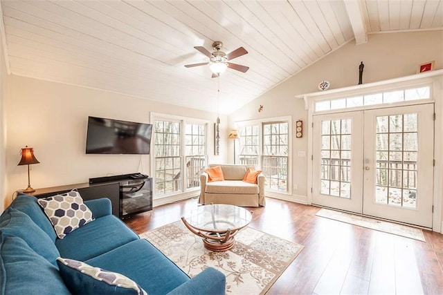 living area featuring french doors, vaulted ceiling with beams, wood ceiling, ceiling fan, and wood finished floors