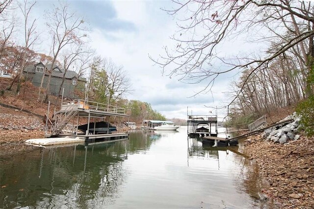 view of dock with a water view and boat lift