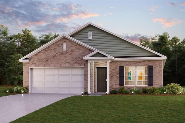 view of front of home with brick siding, driveway, a lawn, and a garage