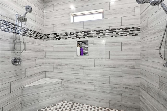 bathroom featuring a tile shower