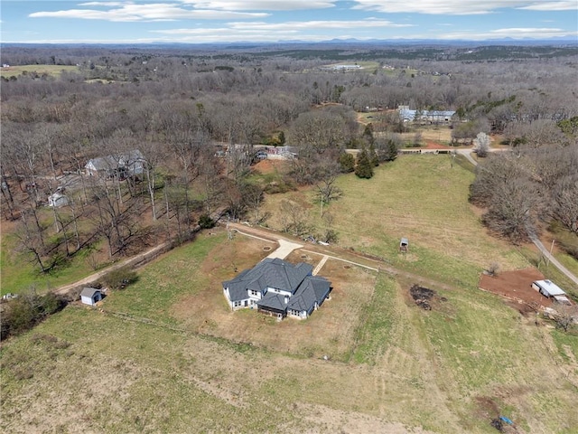 bird's eye view with a rural view and a forest view