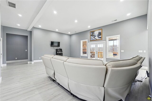 living room featuring visible vents, recessed lighting, french doors, light wood finished floors, and baseboards