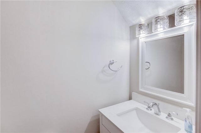 bathroom featuring vanity and a textured ceiling